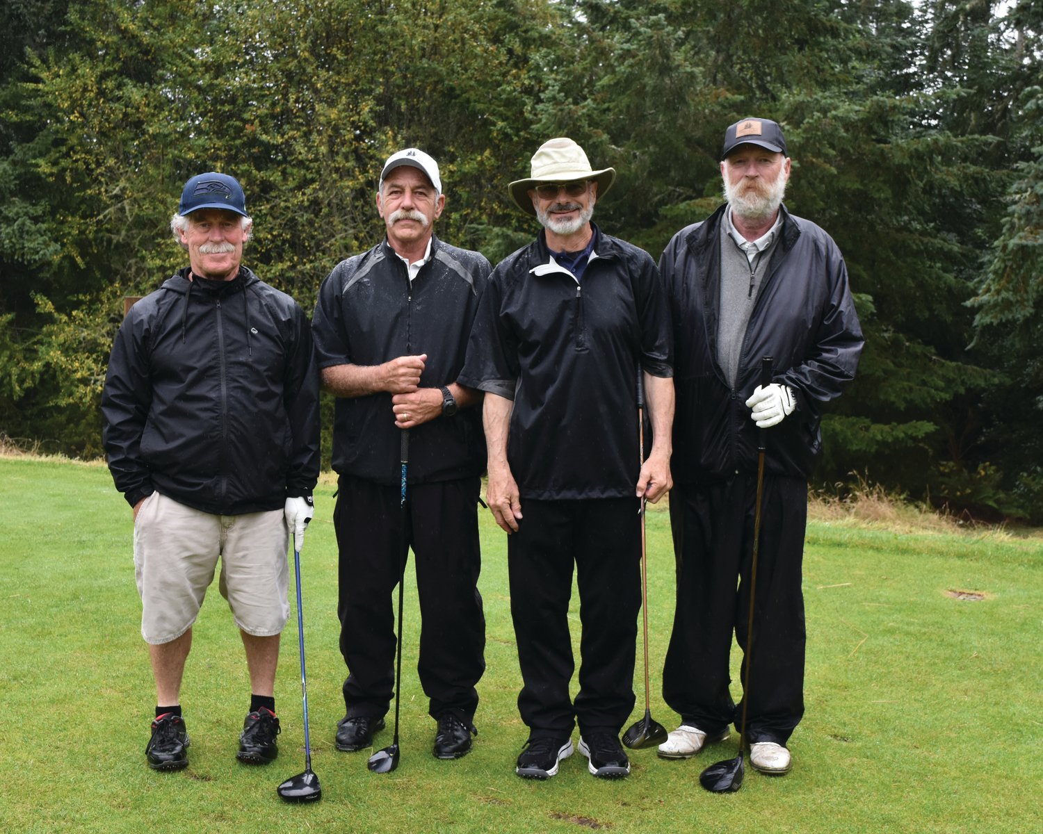 Richard Boyd, Greg Miller, George Cave, and Mike Martin won first place in the men’s division of the Dove House Golf Tournament.
